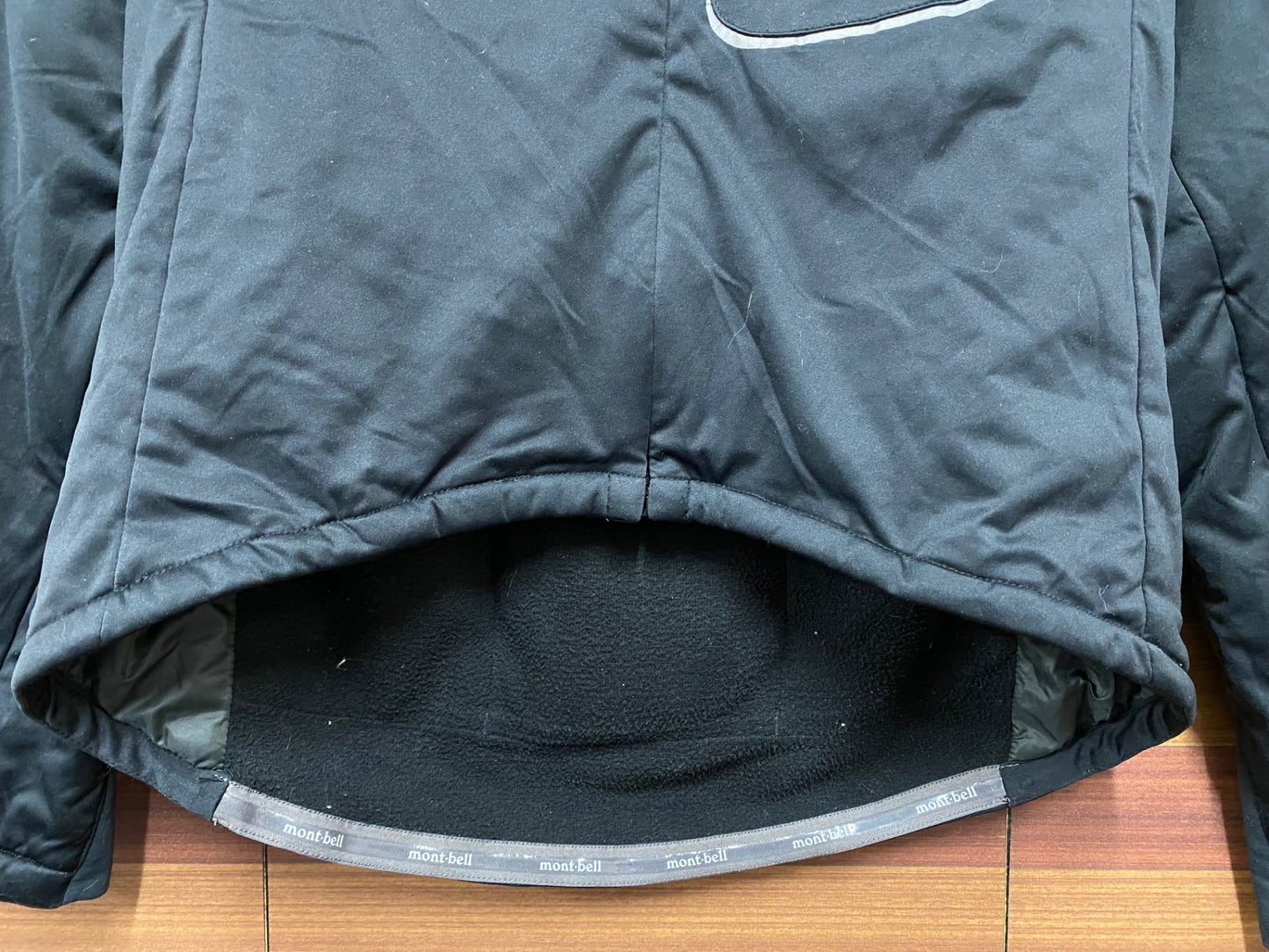 IN563 モンベル mont-bell 長袖 サイクルジャケット 黒 XS 裏起毛 中綿 ※動物の毛