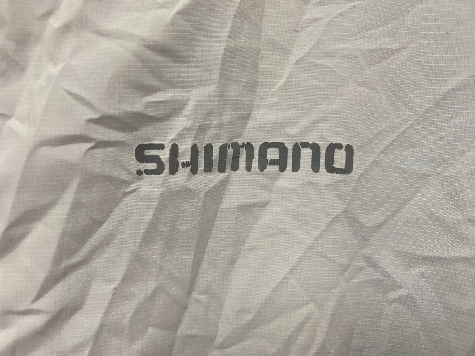 HY913 シマノ SHIMANO ポケッタブル ウィンドブレーカー 白 L ※プリント劣化
