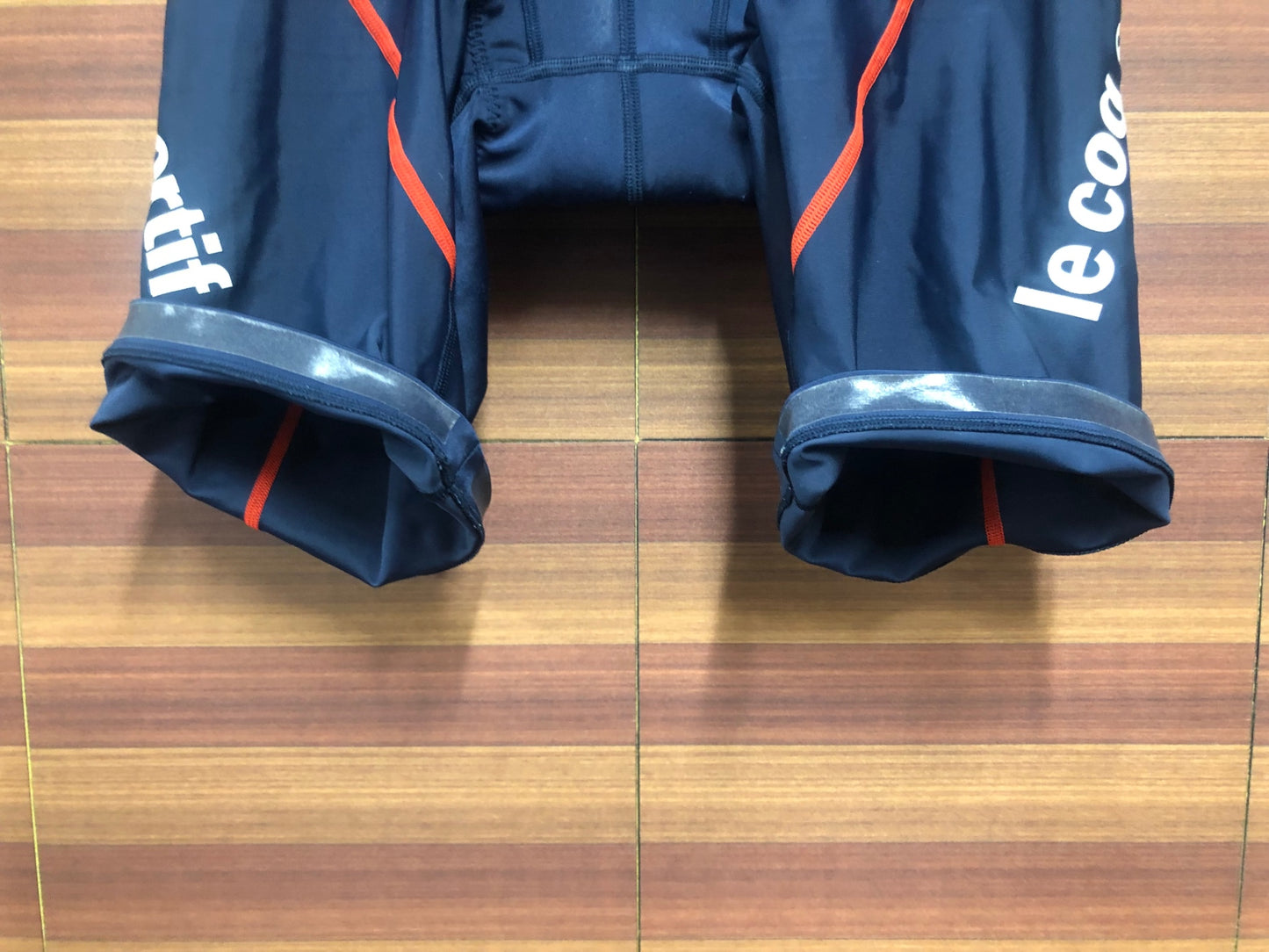 IO084 ルコックスポルティフ le coq sportif レーサーパンツ 紺 赤 O ※擦れ